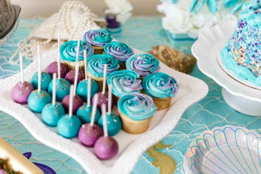 blue Cake Pops and cupcakes at baby shower